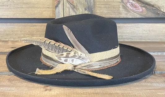 One of our favorites from American Hat Makers. A wide pencil brim layered with multiple bands and a double wrapped copper chain. Styled with unique feathers.